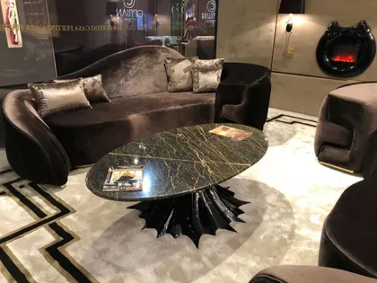 Luxury Gattopardo coffee table with a striking spider pedestal base and premium marble top.
