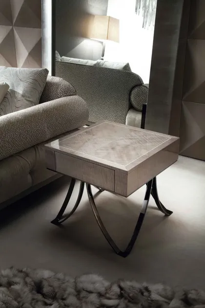 Compact square end table featuring refined finishes to complement the Alchemy sofa and seating arrangements.